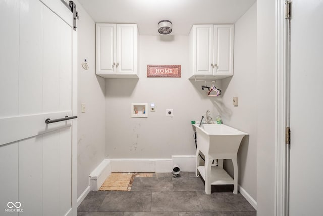 laundry room featuring hookup for a washing machine, cabinet space, baseboards, and electric dryer hookup