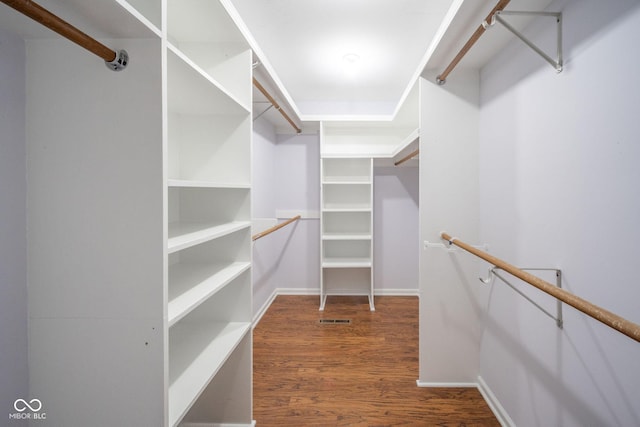 spacious closet with visible vents and wood finished floors