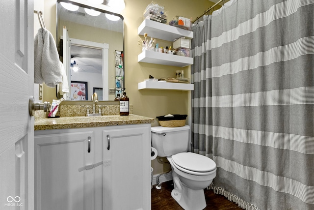12612 Clearview Ln, Indianapolis, IN 46236 - full bath with toilet, vanity, wood finished floors, a shower with curtain, and ceiling fan