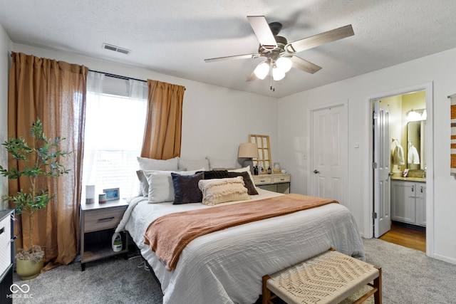 12612 Clearview Ln, Indianapolis, IN 46236 - carpeted bedroom featuring ensuite bathroom and ceiling fan