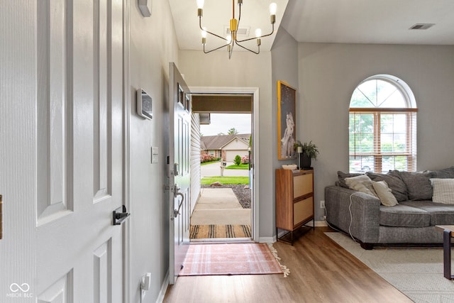 12612 Clearview Ln, Indianapolis, IN 46236 - entrance foyer with wood finished floors, a chandelier, and baseboards