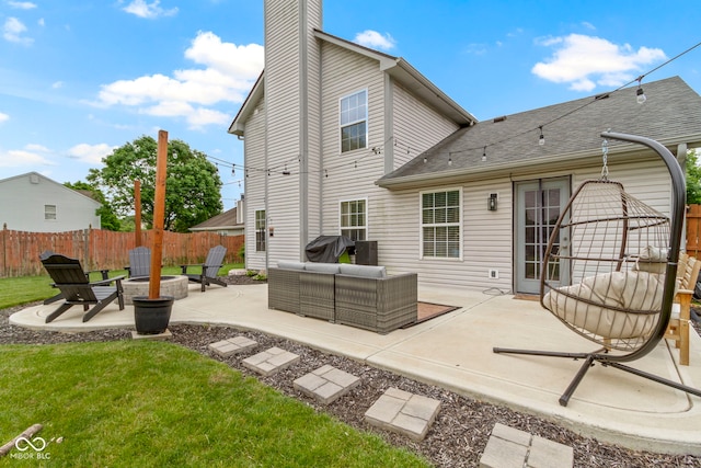 12612 Clearview Ln, Indianapolis, IN 46236 - back of property with a patio area, roof with shingles, a chimney, and an outdoor living space with a fire pit