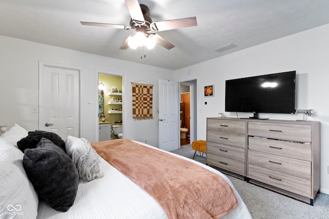 12612 Clearview Ln, Indianapolis, IN 46236 - carpeted bedroom featuring connected bathroom, a ceiling fan, and baseboards