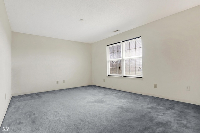 empty room featuring carpet flooring