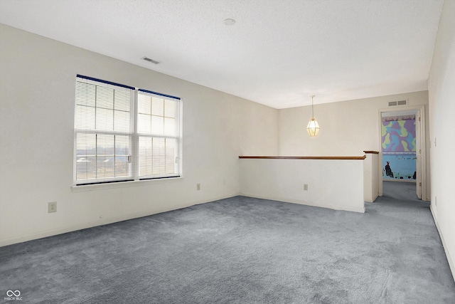 empty room with light colored carpet and visible vents