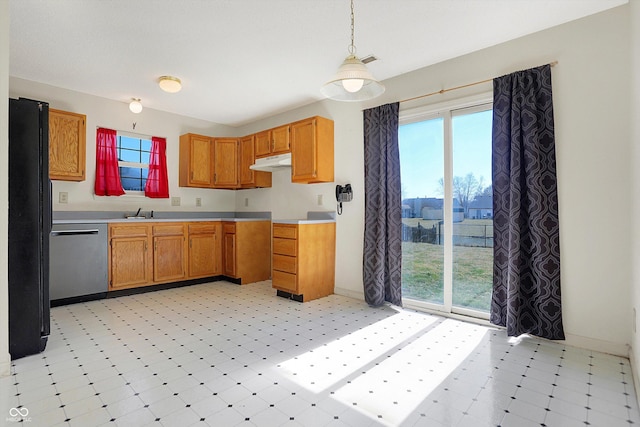 kitchen with under cabinet range hood, light floors, dishwasher, light countertops, and freestanding refrigerator