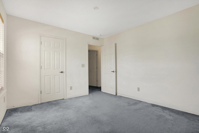 unfurnished bedroom with carpet flooring