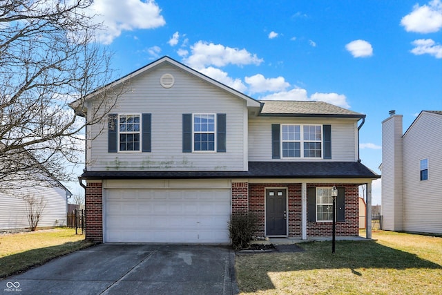 traditional-style home featuring a garage, driveway, brick siding, and a front yard