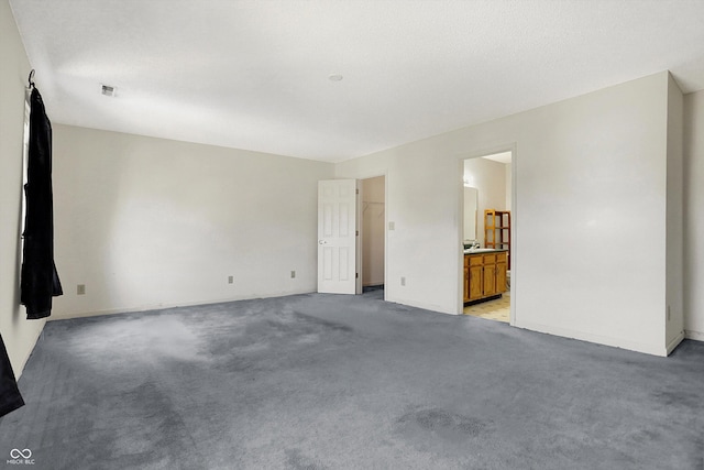 empty room with light colored carpet and visible vents