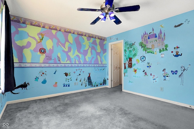 interior space featuring baseboards, carpet, and a ceiling fan