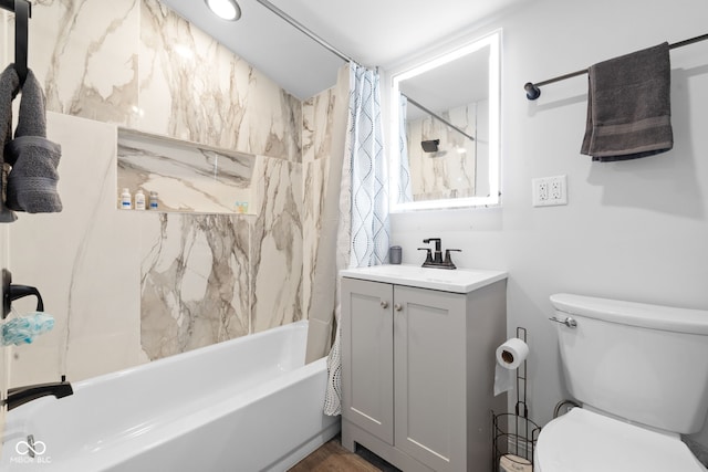 bathroom with vanity, toilet, and shower / bath combo