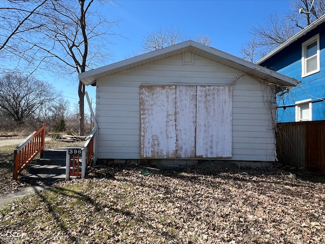 view of shed with fence