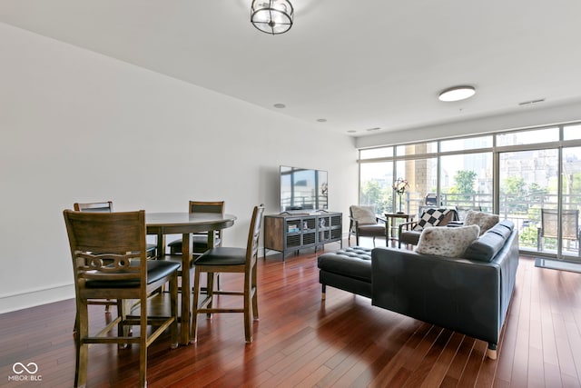 living area with hardwood / wood-style floors