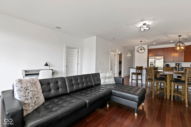 living area with recessed lighting and dark wood-style floors