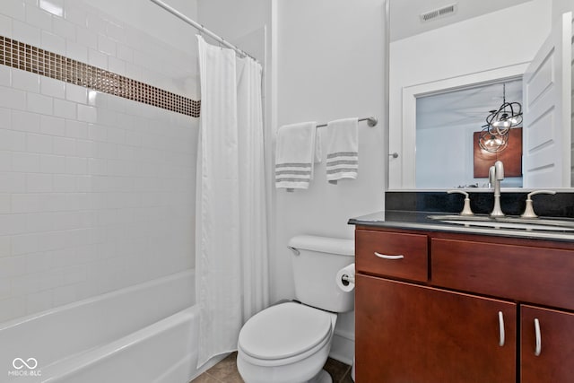 bathroom featuring vanity, visible vents, shower / bath combo, tile patterned floors, and toilet