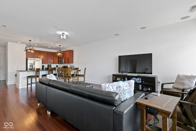 living room featuring recessed lighting, visible vents, baseboards, and dark wood finished floors