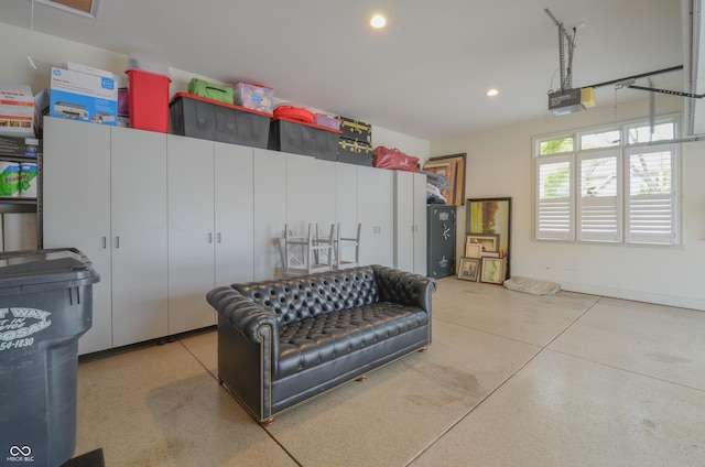 garage featuring a garage door opener and recessed lighting
