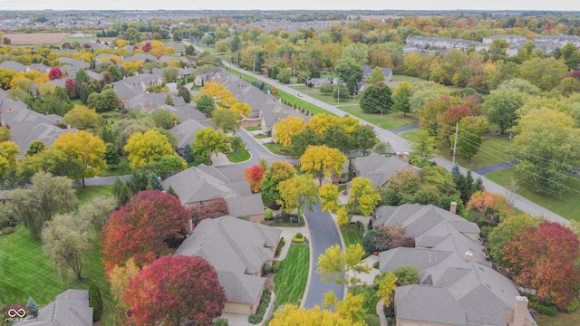 birds eye view of property with a residential view
