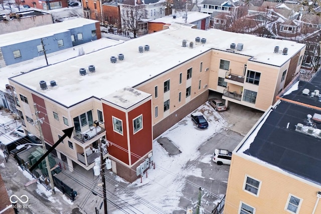 snowy aerial view featuring a residential view