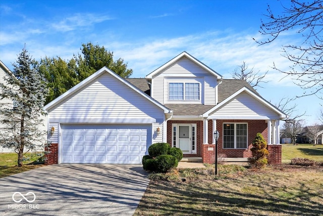 traditional-style home with concrete driveway, an attached garage, covered porch, and brick siding