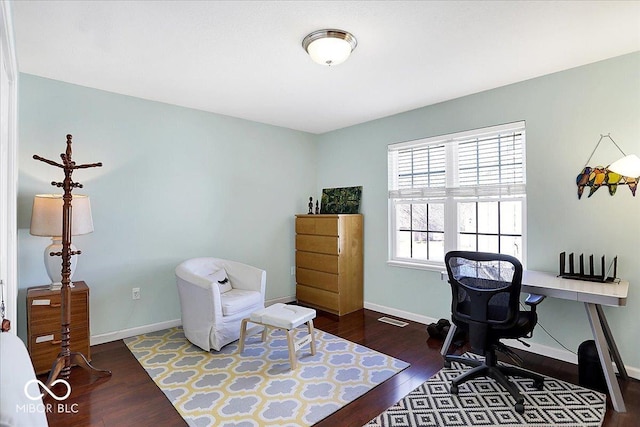 home office featuring visible vents, wood finished floors, and baseboards