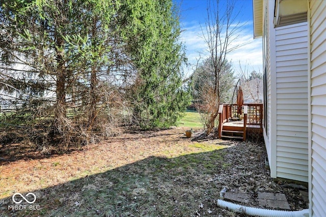 view of yard featuring a wooden deck