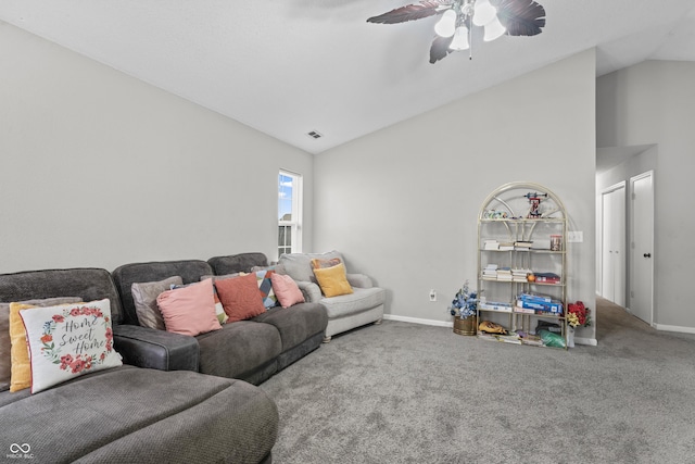 living room featuring vaulted ceiling, carpet flooring, a ceiling fan, and baseboards