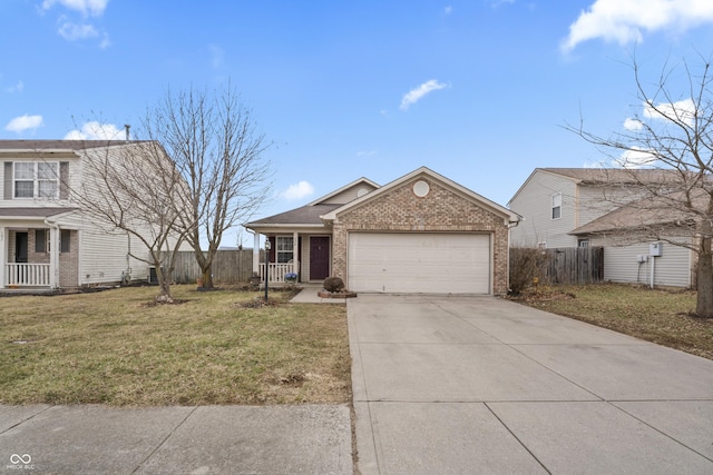 view of front of home with a front yard, fence, driveway, a porch, and brick siding