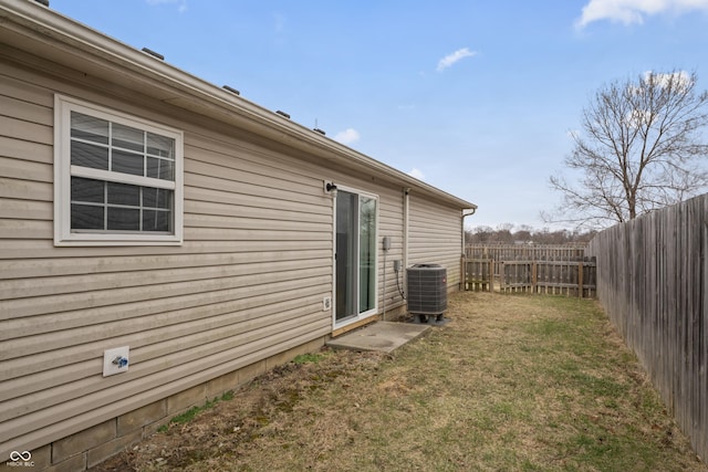 view of yard with cooling unit and a fenced backyard