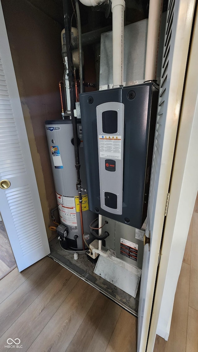 utility room with water heater