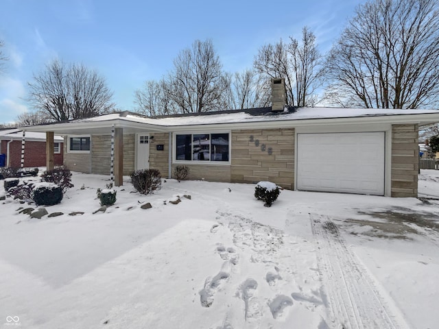 view of front of home with a garage and a chimney