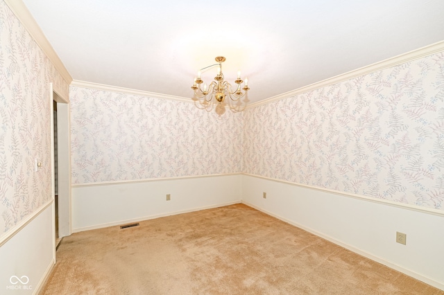 carpeted empty room with a chandelier, visible vents, wallpapered walls, and crown molding