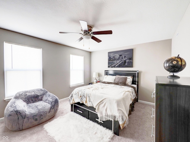 bedroom with carpet flooring, a ceiling fan, and baseboards