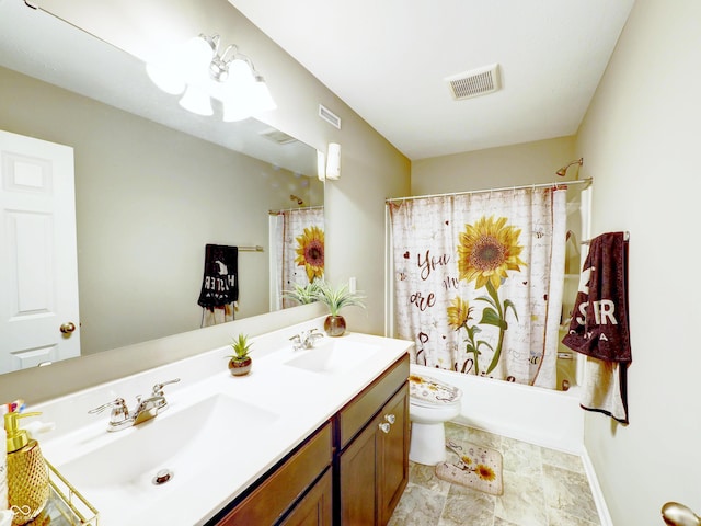 full bathroom featuring double vanity, visible vents, toilet, and a sink