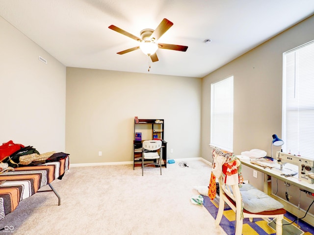 rec room with visible vents, ceiling fan, baseboards, and carpet