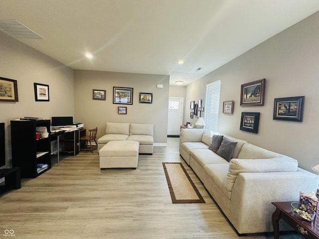 living room with visible vents, recessed lighting, light wood-type flooring, and baseboards