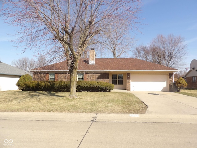 ranch-style home featuring a front lawn, concrete driveway, a garage, brick siding, and a chimney