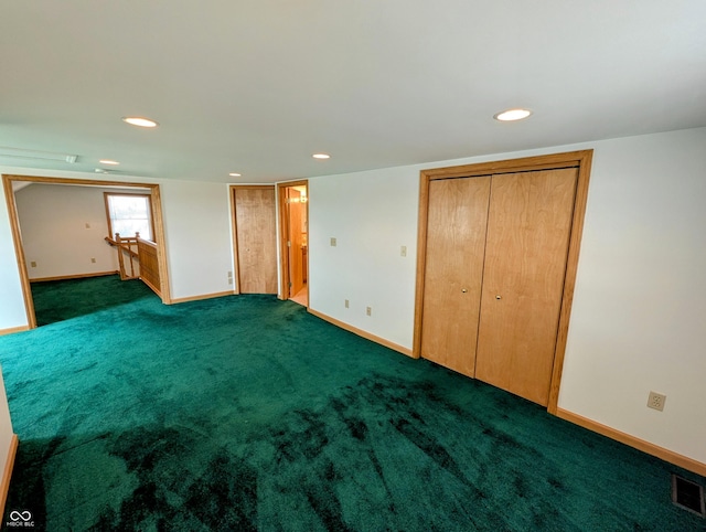 unfurnished bedroom with visible vents, recessed lighting, connected bathroom, carpet flooring, and baseboards