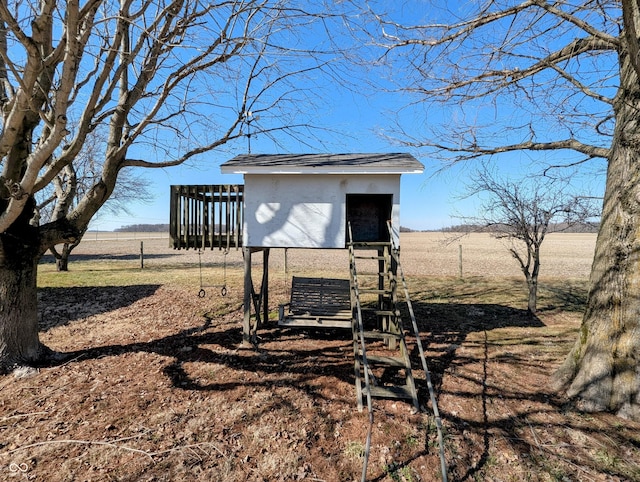 view of outdoor structure with an outbuilding and a rural view