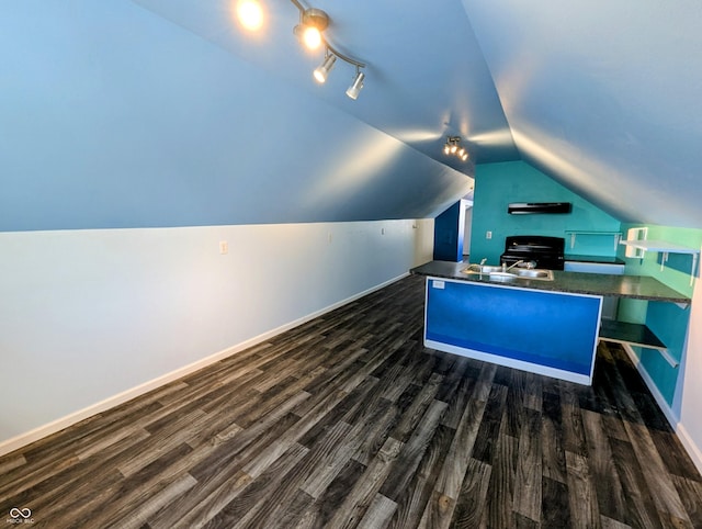 office area with a sink, baseboards, lofted ceiling, and dark wood-style flooring