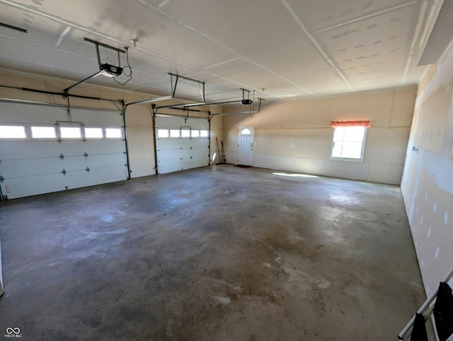 garage featuring a garage door opener