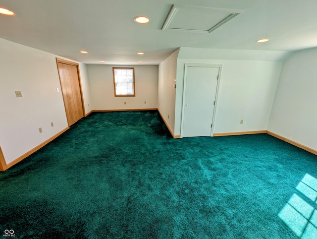 spare room with attic access, recessed lighting, baseboards, and carpet