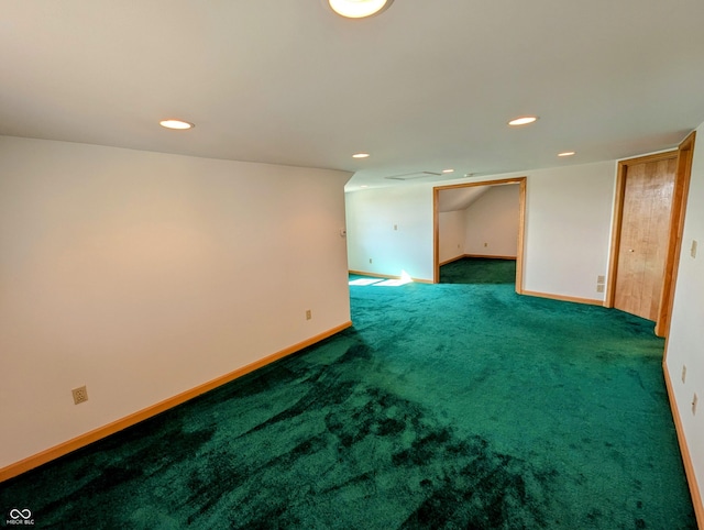 carpeted empty room featuring recessed lighting and baseboards