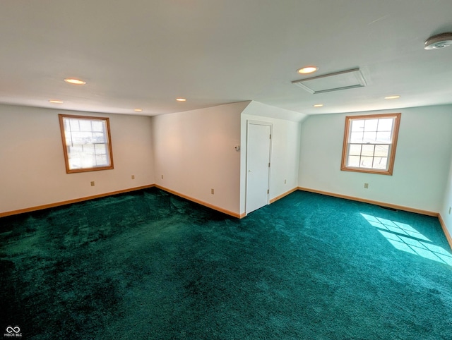 interior space with plenty of natural light, attic access, and baseboards