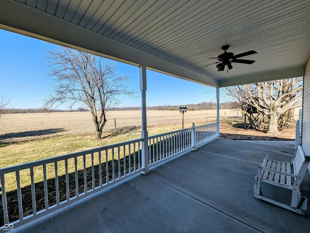 view of patio / terrace featuring a rural view and a ceiling fan