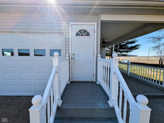 property entrance featuring a porch and a garage