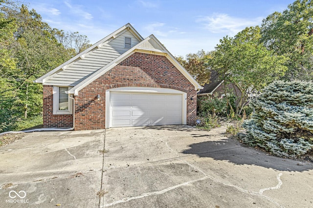 garage with concrete driveway