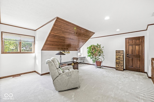 living area with visible vents, ornamental molding, baseboards, and carpet floors