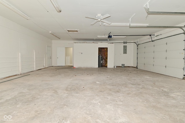 garage with electric panel and a garage door opener