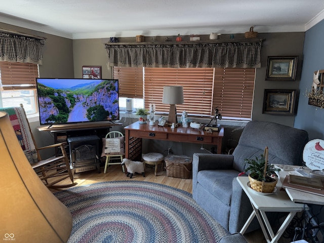 living room with wood finished floors and ornamental molding